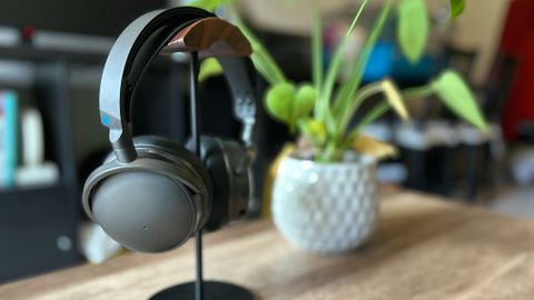 Audeze Maxwell gaming headset on a stand next to a plant