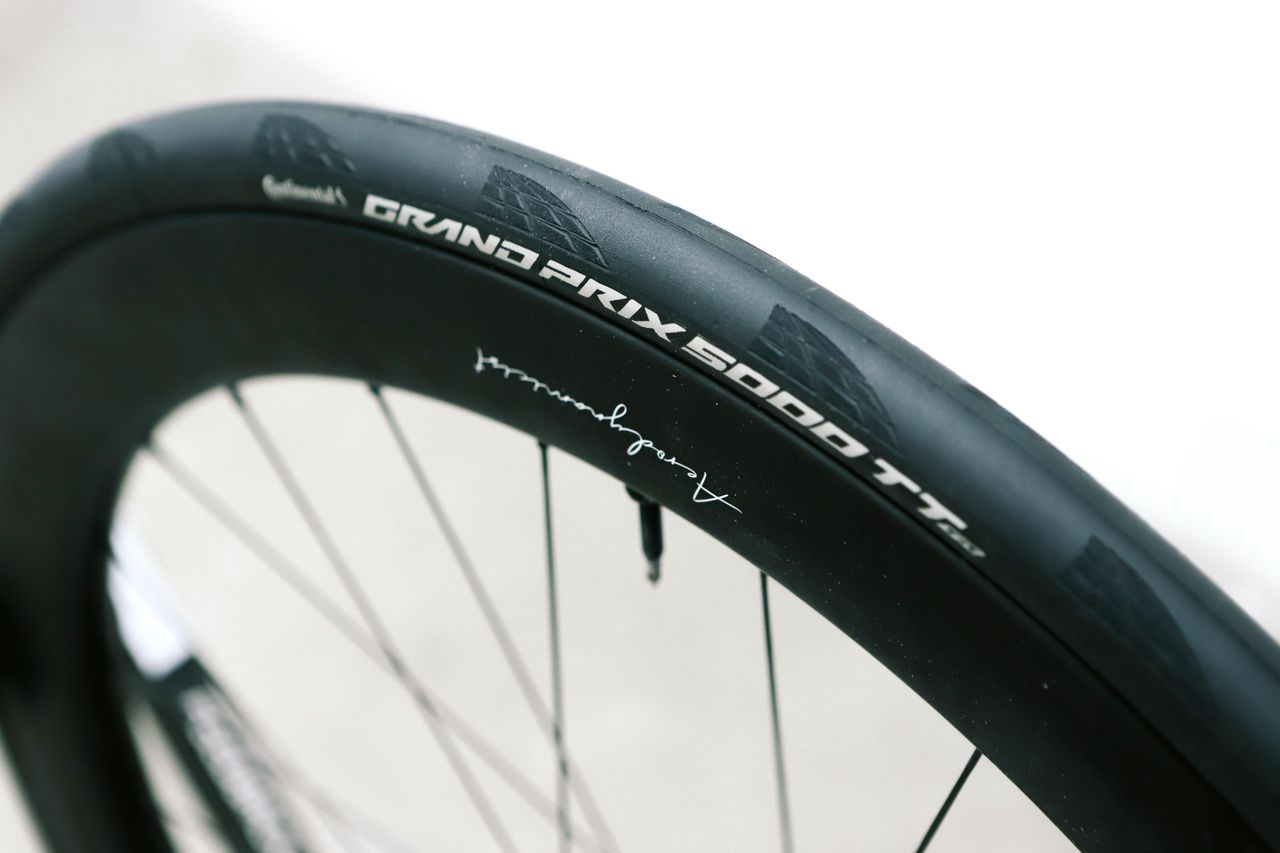 a close up of a black road bike tyre
