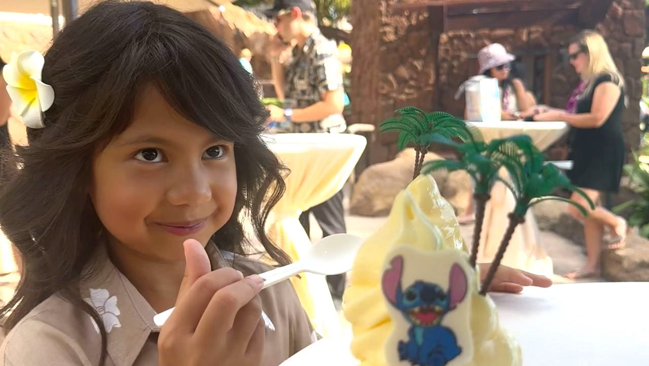 Maia Kealoha eating a Stitch Dole Whip at Aulani Resort on November 21, 2024