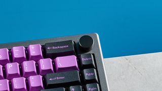 A black and purple Epomaker EK68 wireless mechanical keyboard