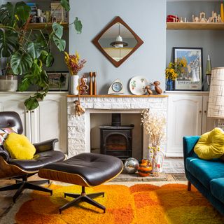Seventies inspired living room with Eames chair, wooden accents and log burner