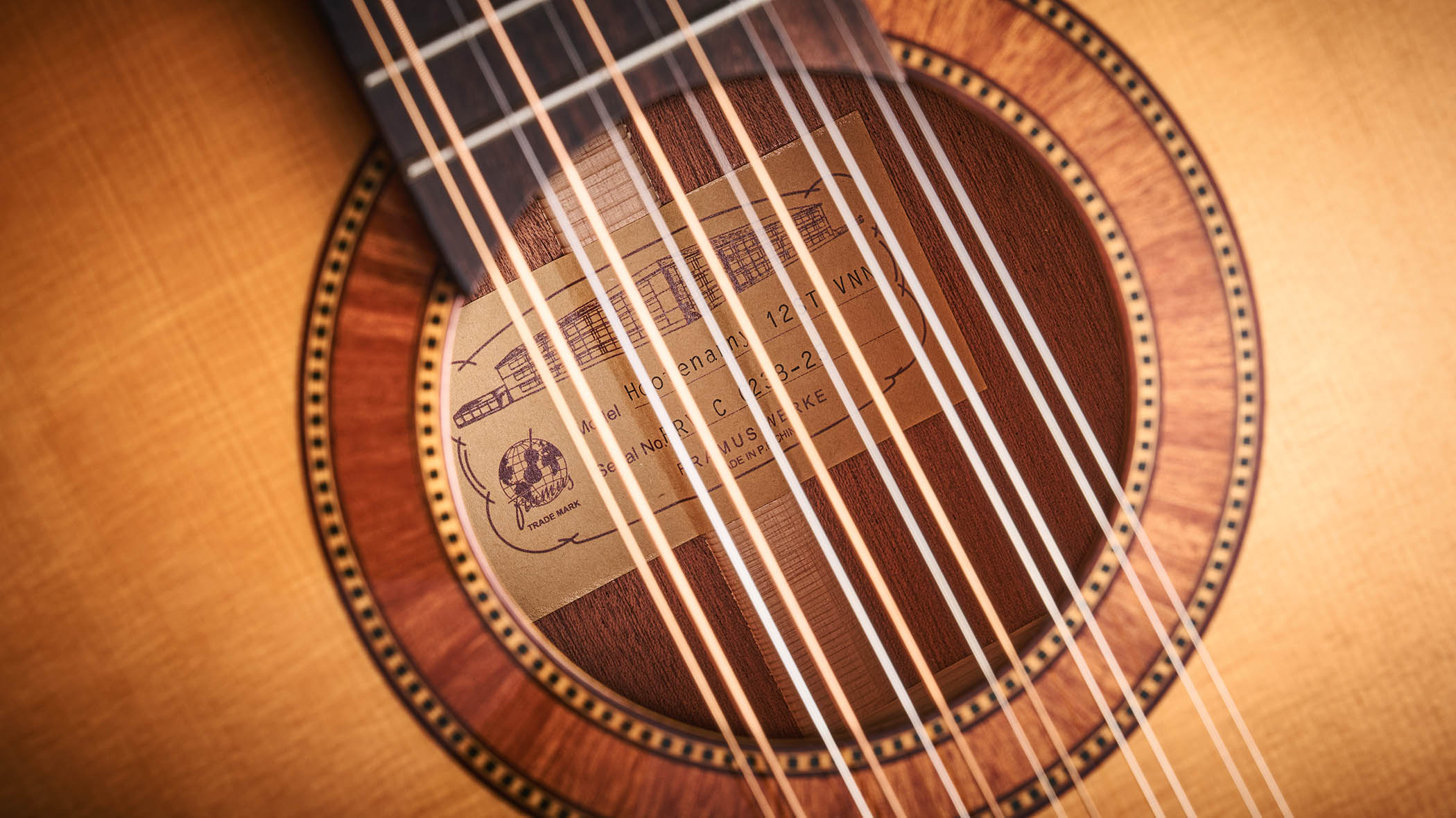 Framus&#039;s replica of original 12-string that John Lennon used on the Beatles&#039; Help! and Rubber Soul, photographed in close-up against a distressed wooden floor.