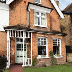 house exterior with white windows and door