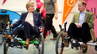 Sophie, Duchess of Edinburgh and Prince Edward, Duke of Edinburgh prepare to take part in an adaptive tricycle race