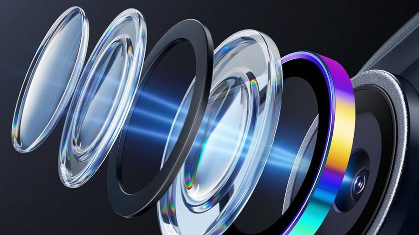 A detailed, exploded view of a smartphone camera lens assembly, showing multiple glass and plastic elements separated from one another, with a blue light beam passing through them.