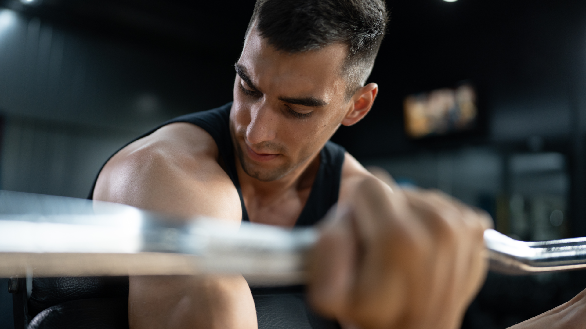 A man doing concentration curls