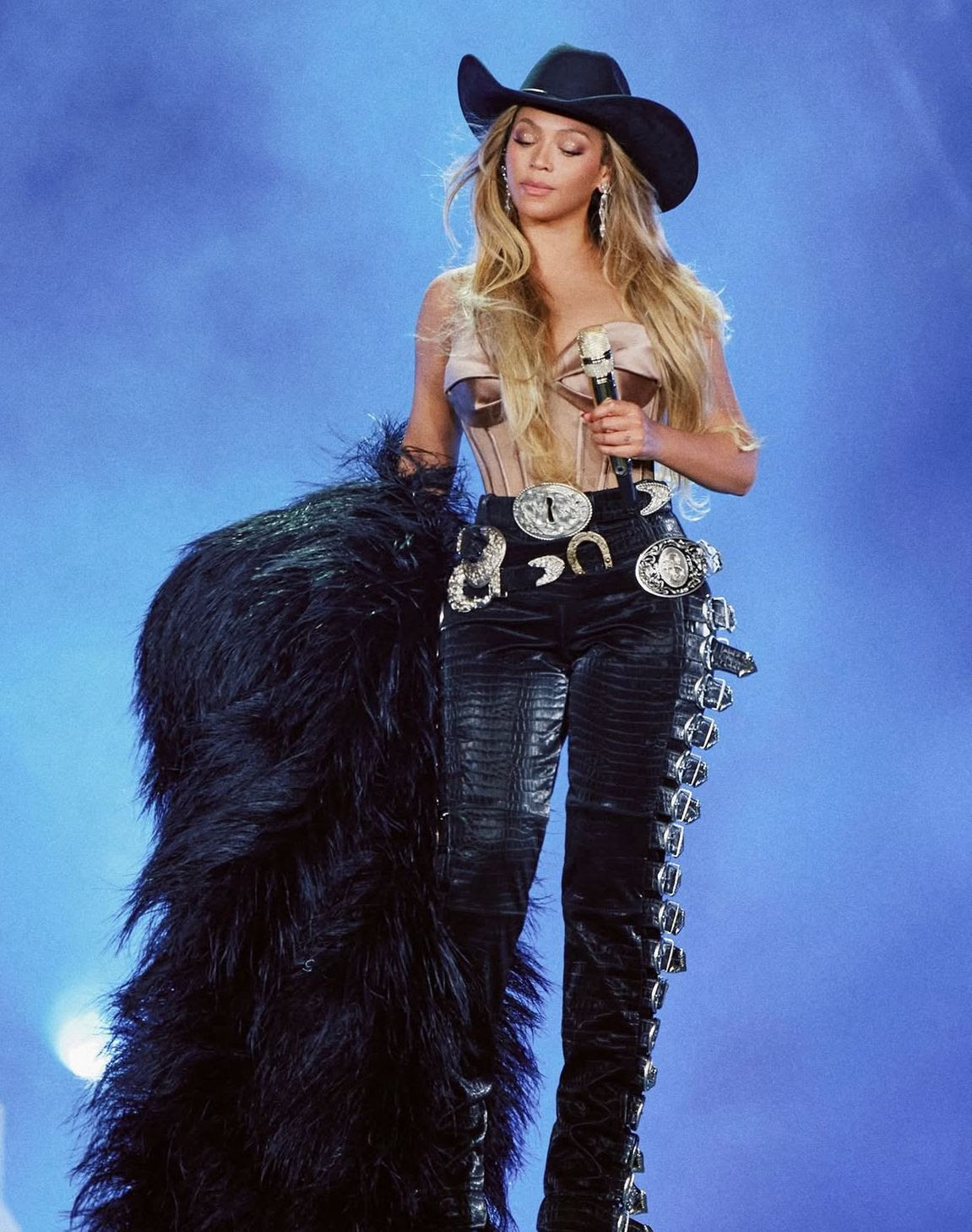Beyoncé wears a double-belt Schiaparelli look on the Cowboy Carter tour.