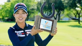 Jenny Shin with the trophy after winning the 2016 Volunteers of America Texas Shootout