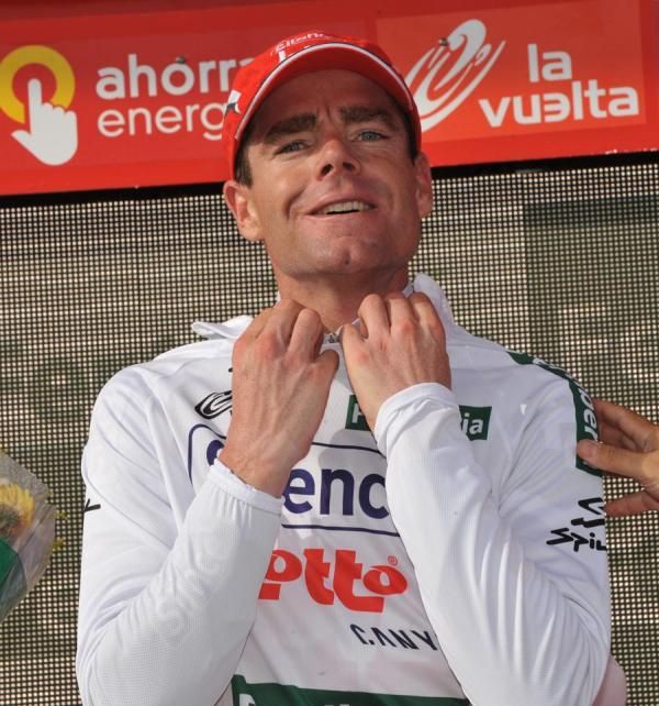 Cadel Evans puts on the white jersey of combination classification leader.