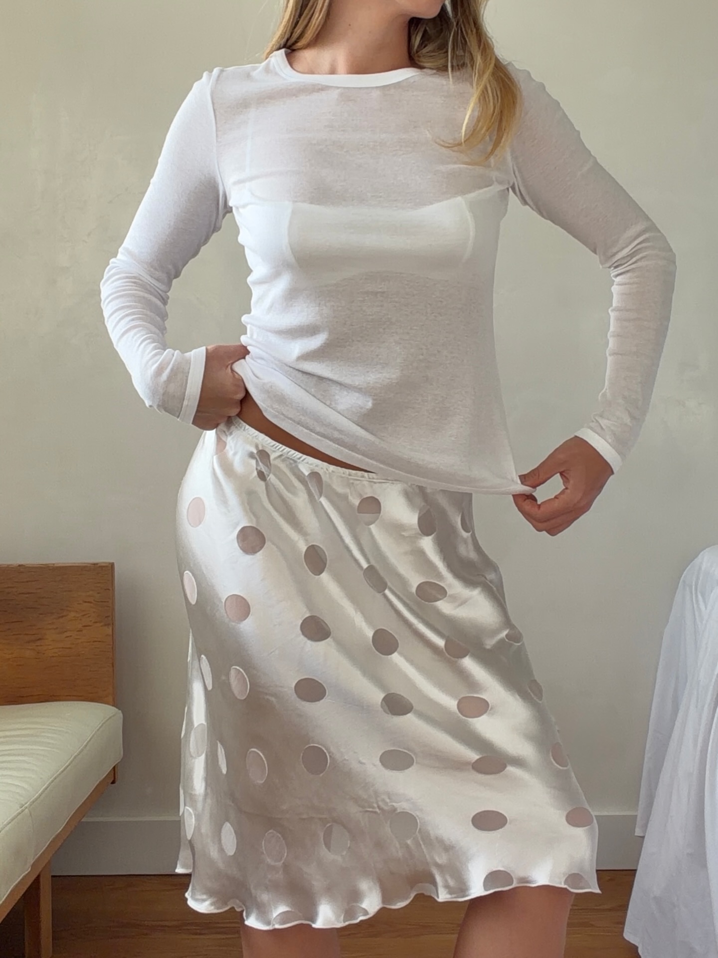 An image of @hannahjuneva wearing a polka-dot skirt, one of the biggest summer trends of 2026.