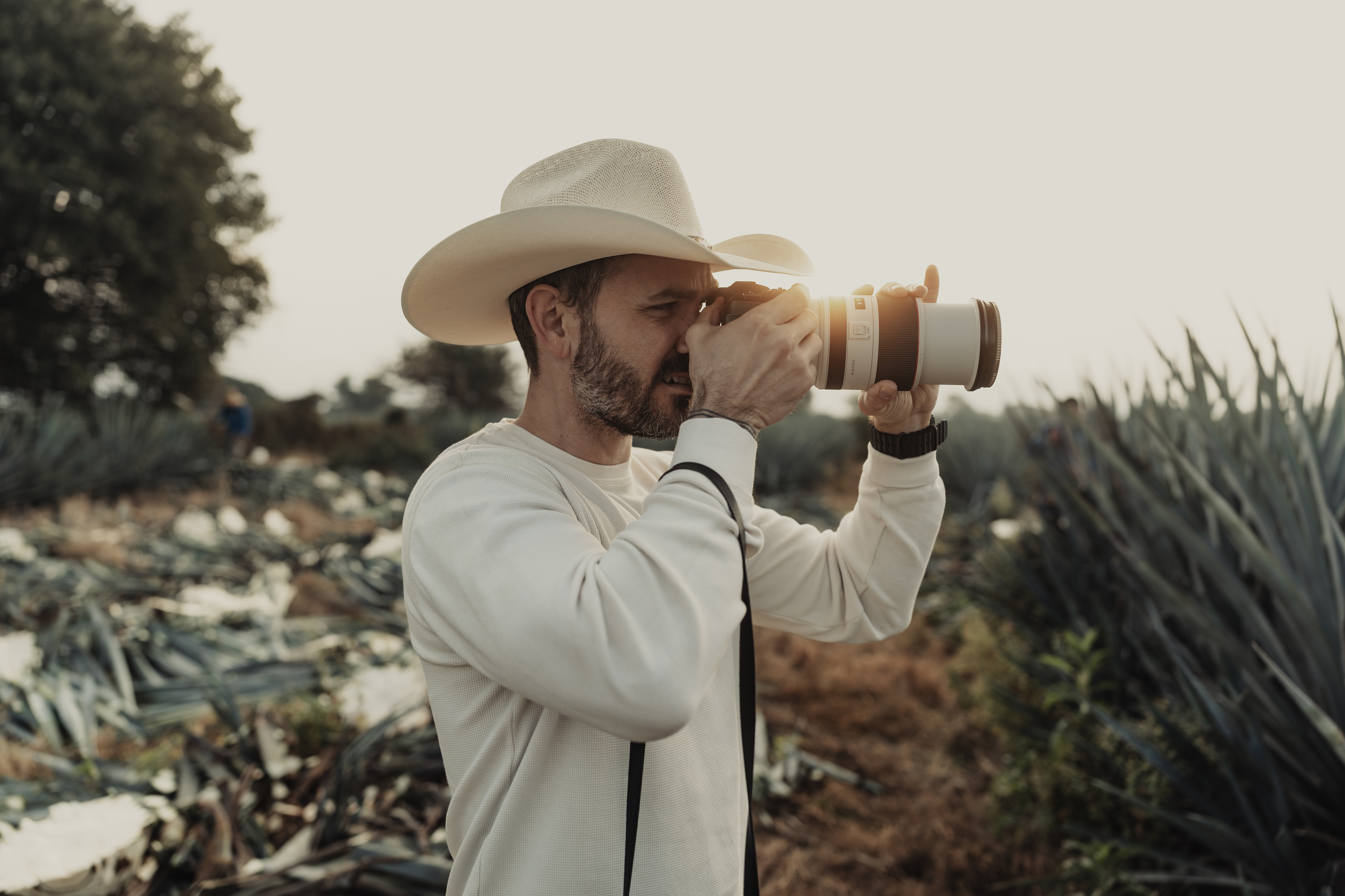The PolarPro Goldstache filter being used by a photographer wearing a cowboy hat