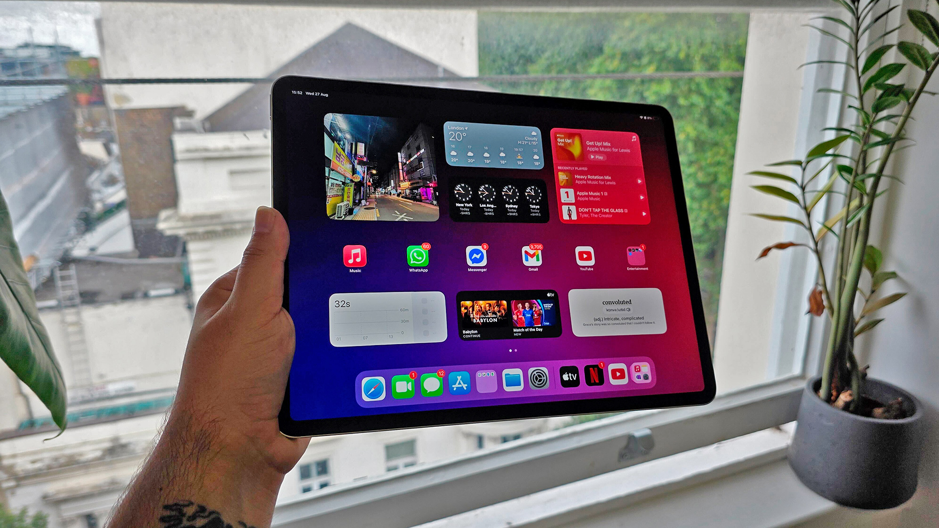 Apple iPad Air 13-inch (2025) tablet held in hand in front of window