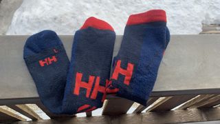 Helly Hansen Alpine Technical socks hanging on a balcony