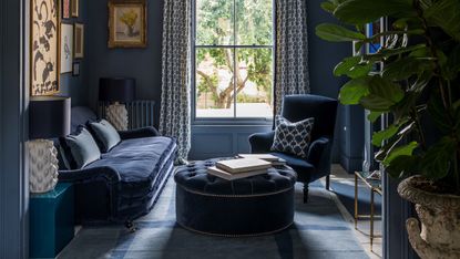 A dark blue monochromatic living room