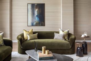 Green velvet sofa, black marble coffee table, horizontal textured wallpaper