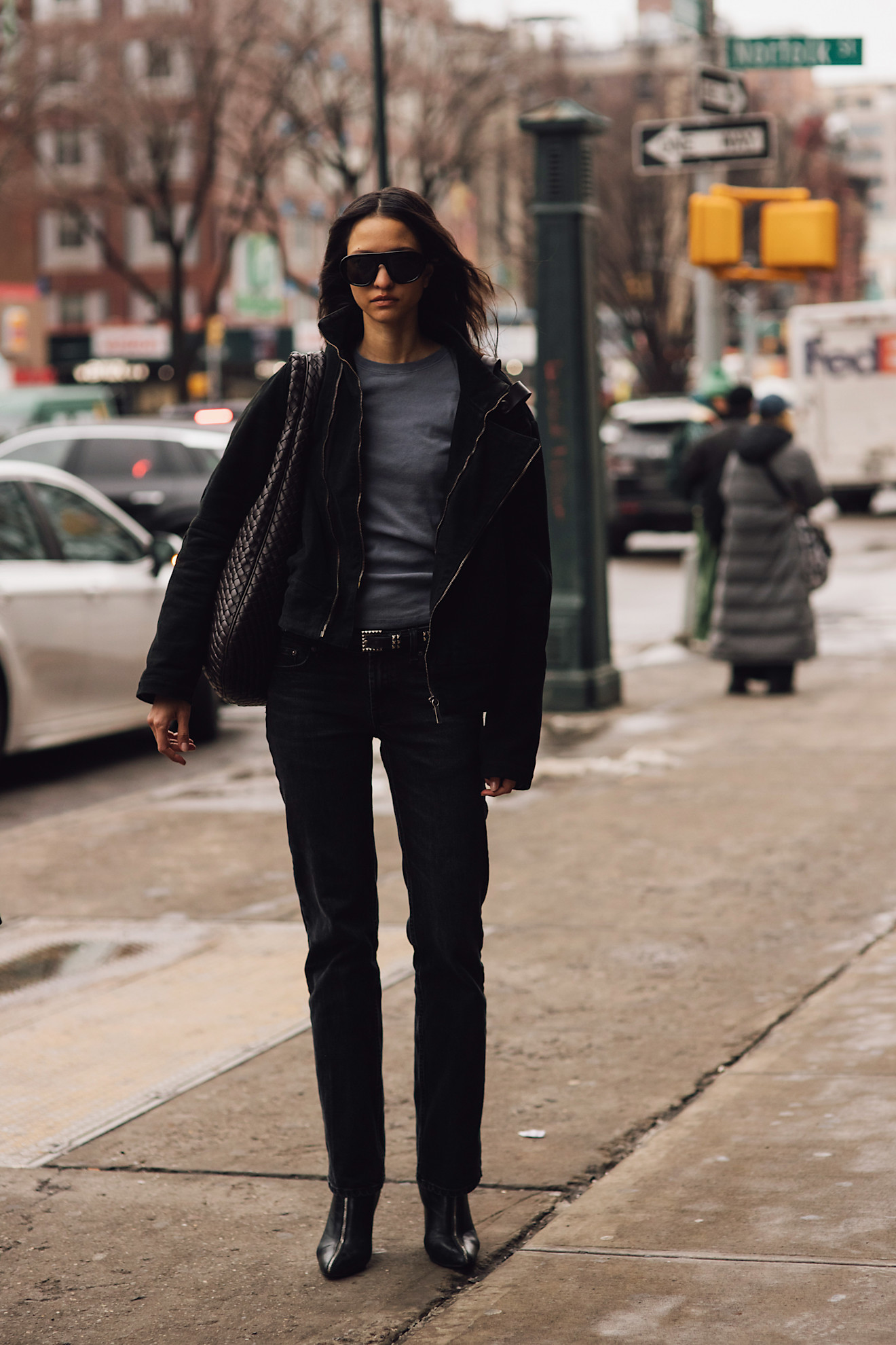 A woman wears straight jeans to fashion week.