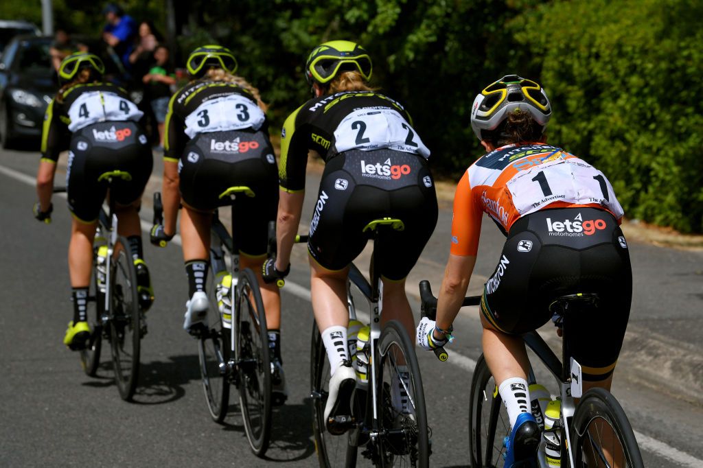 Amanda Spratt sits behind her Mitchelton-Scott teammates