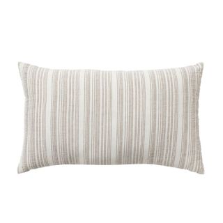 A rectangular throw pillow with white and beige thin stripes across it