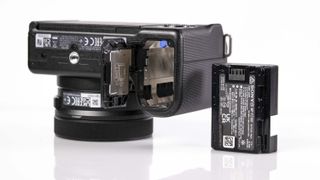 Sony ZV-E10 II on reflective surface and white background