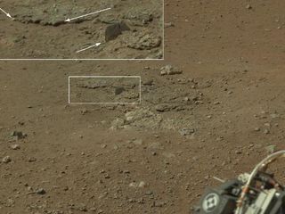 This color image from NASA's Curiosity rover, taken on Aug. 8, 2012, shows an area excavated by the blast of its sky crane rocket engines.