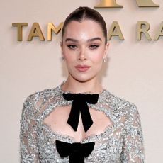 Hailee Steinfeld wore an illusion dress at the Tamara Ralph Couture Week show, the same designer behind her wedding gown