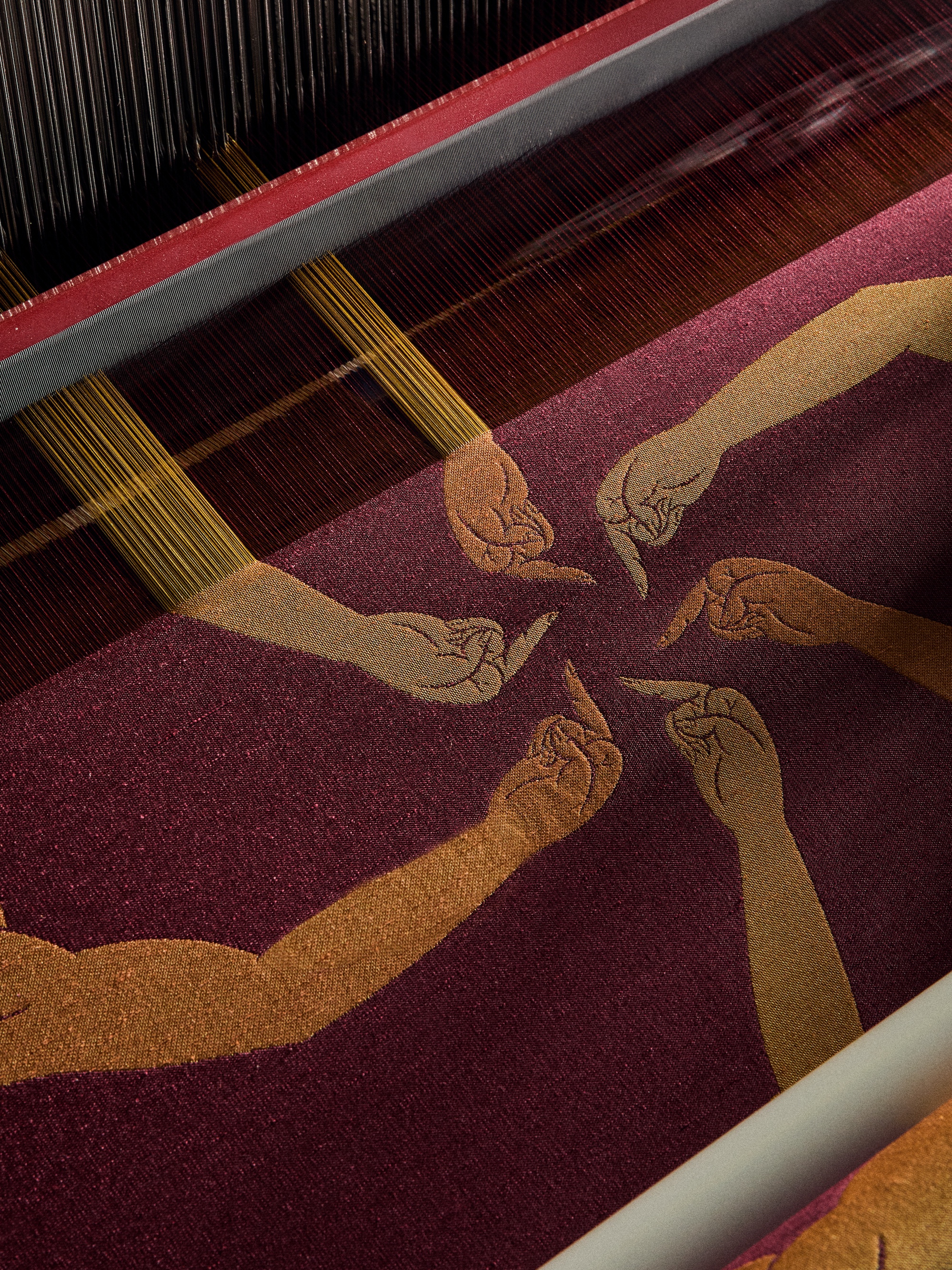 Detail of the fabric &amp;lsquo;Finger&amp;rsquo;, which serves as a scenic backdrop to two display cases containing textile documents from the Rubelli Historical Archive and the Rubelli Foundation