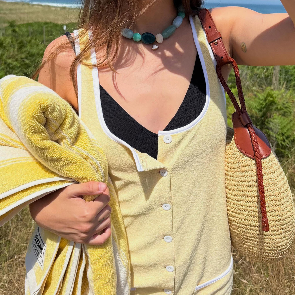 @helenacuesta selfie closeup in sezane yellow terry cover-up dress and multicolor stone necklace