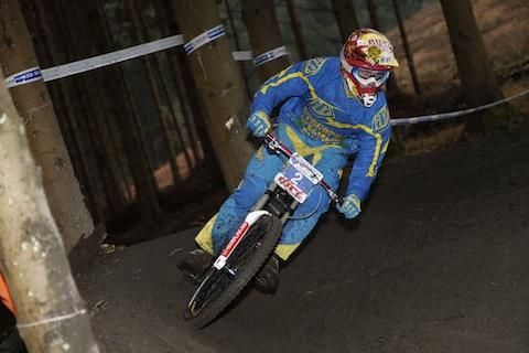 A rider descends through the forest at the 661 Mini Downhill.