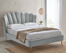 Dunelm Vivian Bed in room in grey, sitting on jute rug with white bedding and grey throw
