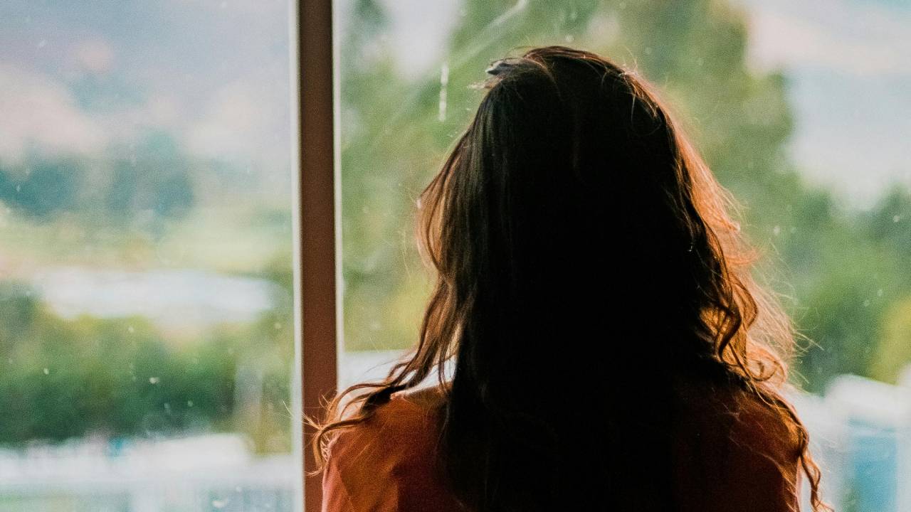 A woman looking out the window