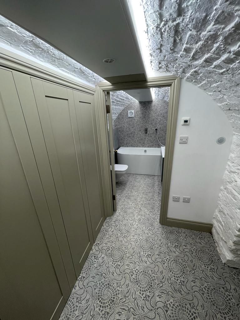 Olive green units of a utility area in the air raid shelter