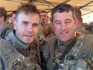 Gary posed for photos in full military get-up at Camp Bastion