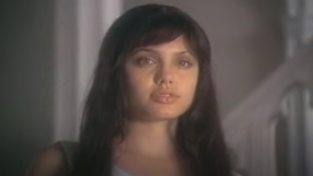 Angelina Jolie as Gina in Love Is All There Is