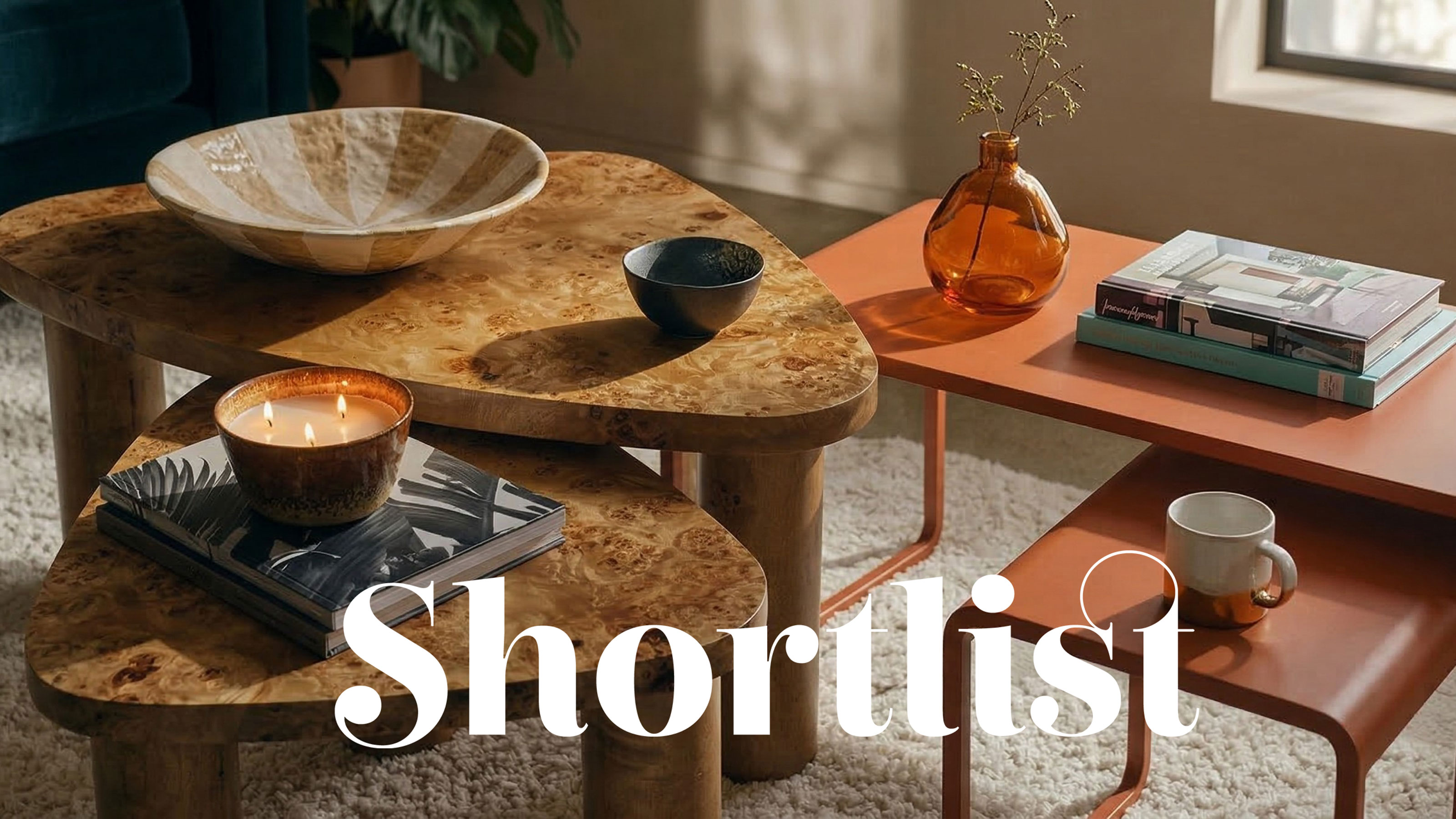 Two nesting coffee tables with bowls displayed on top next to each other in a living room