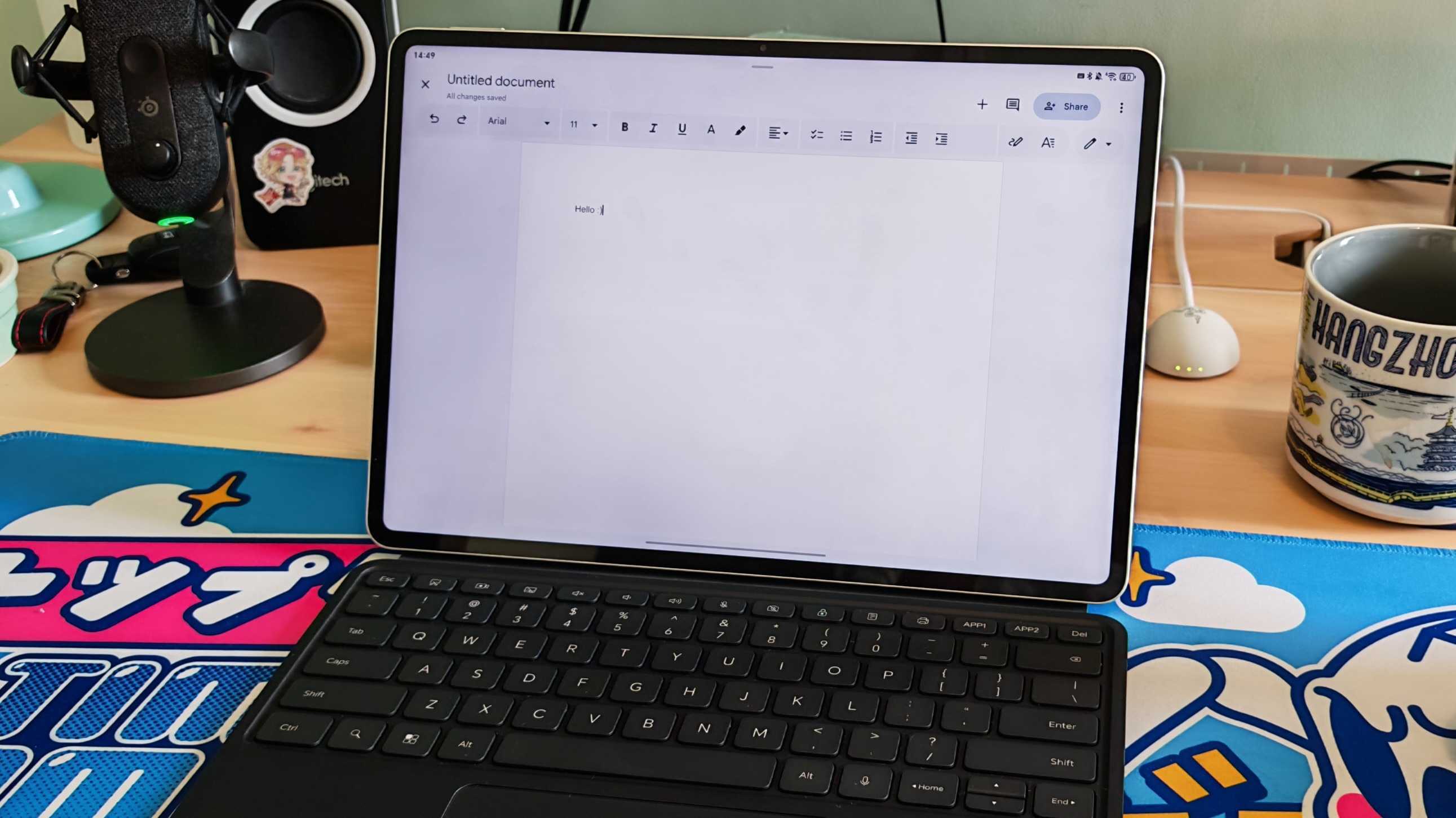 The Honor MagicPad 3 placed on a colorful desk mat.