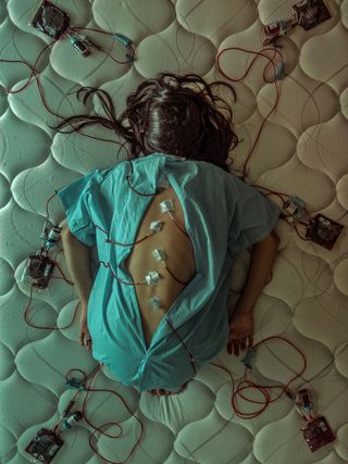 A woman in a hospital robe