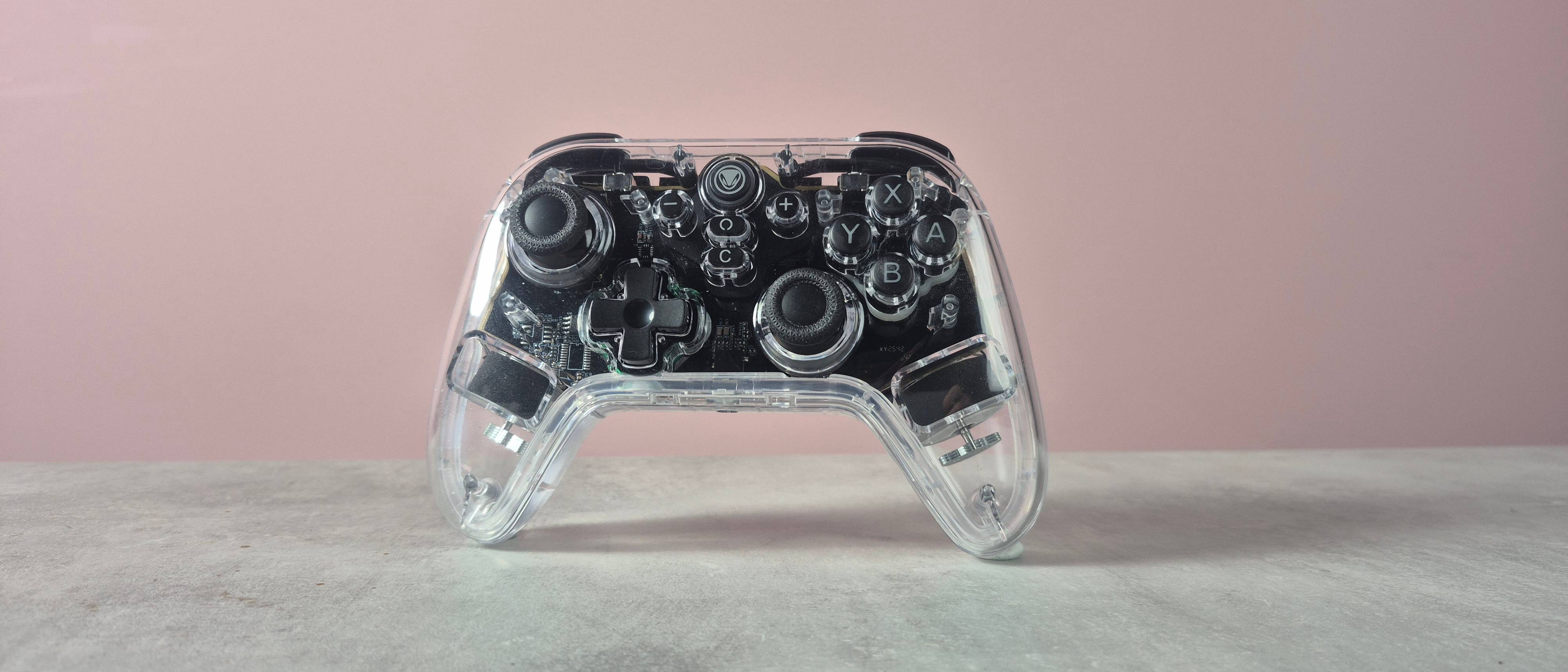Snakebyte Gamepad RGB S2 against pink backgrounds