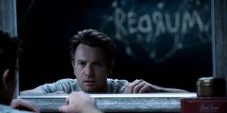 Danny Torrance stares into a mirror and sees the word 'Redrum' in the reflection in a scene from 'Do