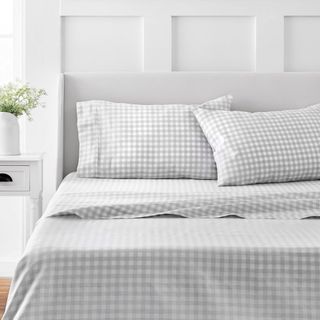 Martha Stewart 100% Cotton Sheet Set in Gray Gingham on a bed.