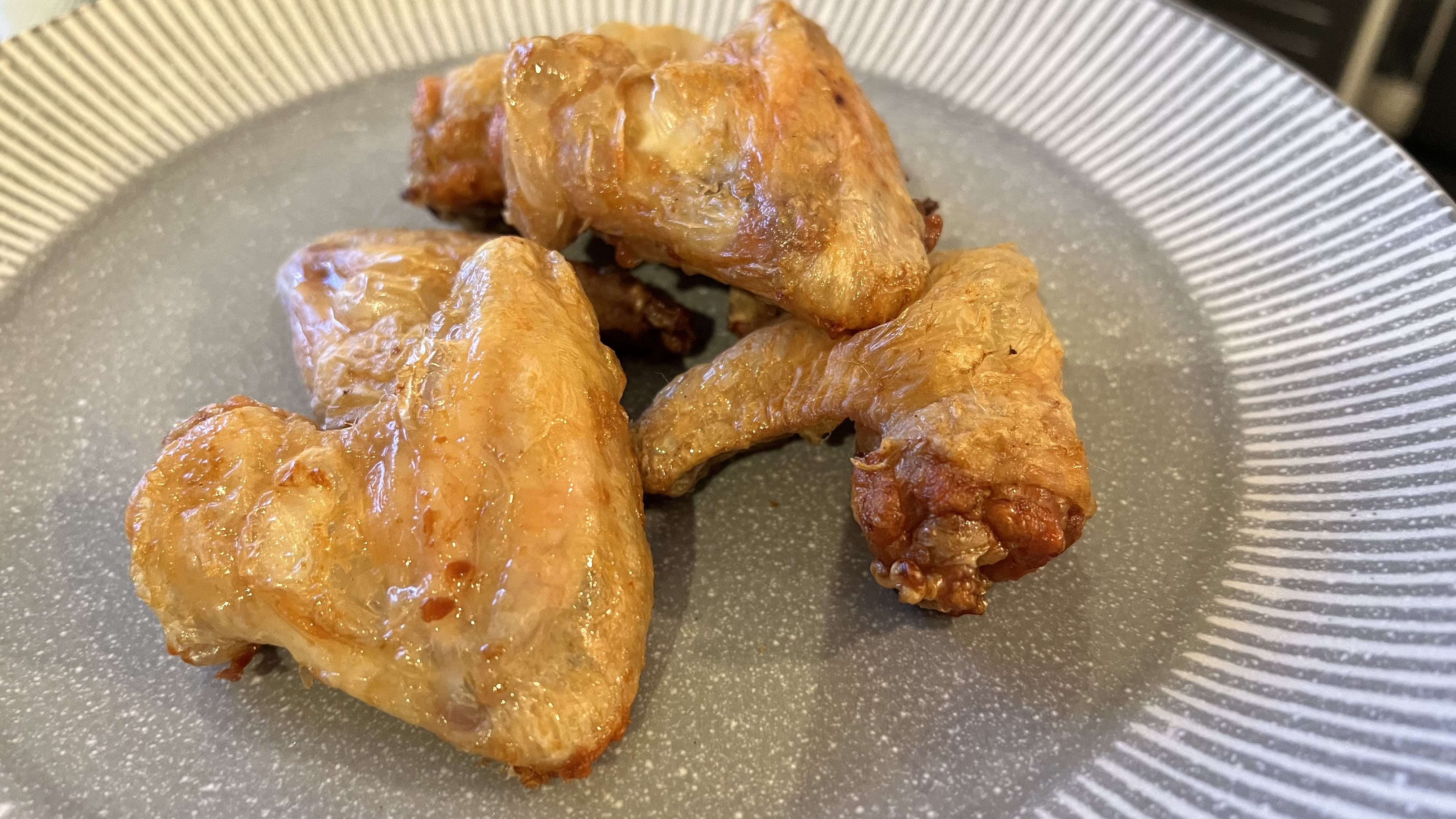 Air fried chicken wings on a plate