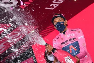 SEGA DI ALA ITALY MAY 26 Egan Arley Bernal Gomez of Colombia and Team INEOS Grenadiers Pink Leader Jersey celebrates at podium during the 104th Giro dItalia 2021 Stage 17 a 193km stage from Canazei to Sega di Ala 1246m Champagne UCIworldtour girodiitalia Giro on May 26 2021 in Sega di Ala Italy Photo by Stuart FranklinGetty Images