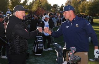 Greg Norman and Bryson DeChambeau fist bump at The Showdown