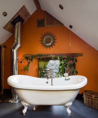 orange bathroom with white bath