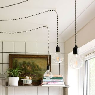 light bulbs hanging from ceiling in kitchen