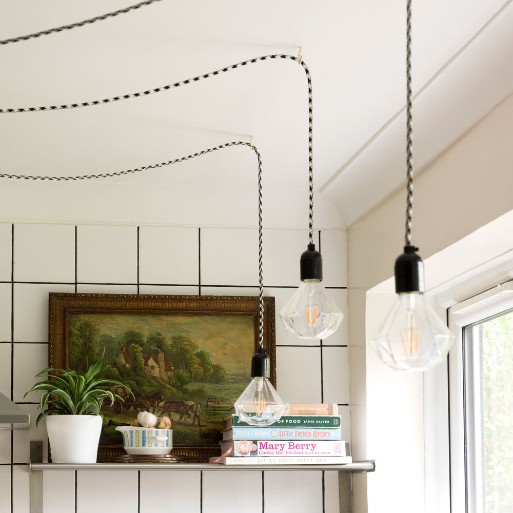 light bulbs hanging from ceiling in kitchen