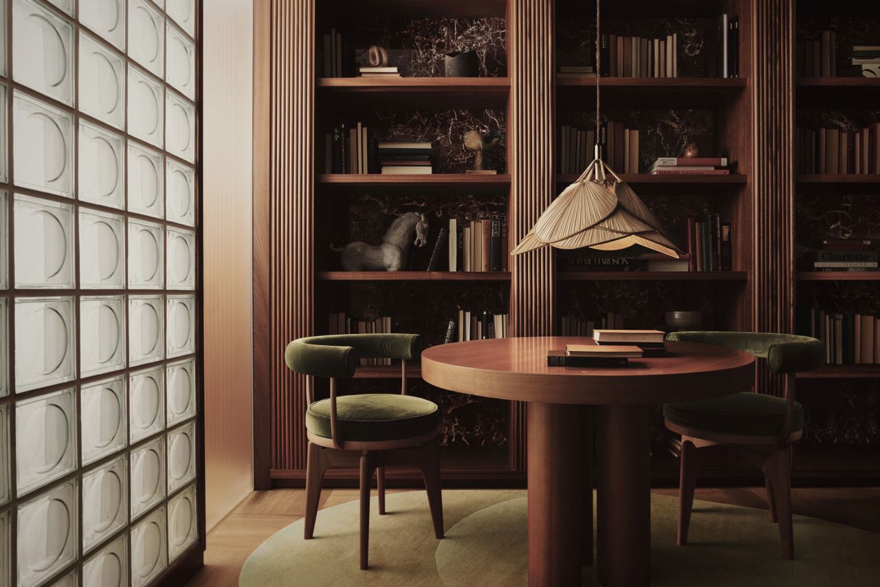 A dining room with a bookshelf