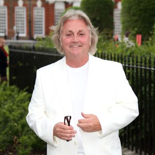 LONDON, ENGLAND - JULY 04: David Emanuel attends the launch party for the Fashion Rules exhibition, a collection of dresses worn by HRH Queen Elizabeth II, Princess Margaret and Diana, Princess of Wales at Kensington Palace on July 4, 2013 in London, England. (Photo by Mike Marsland/WireImage)