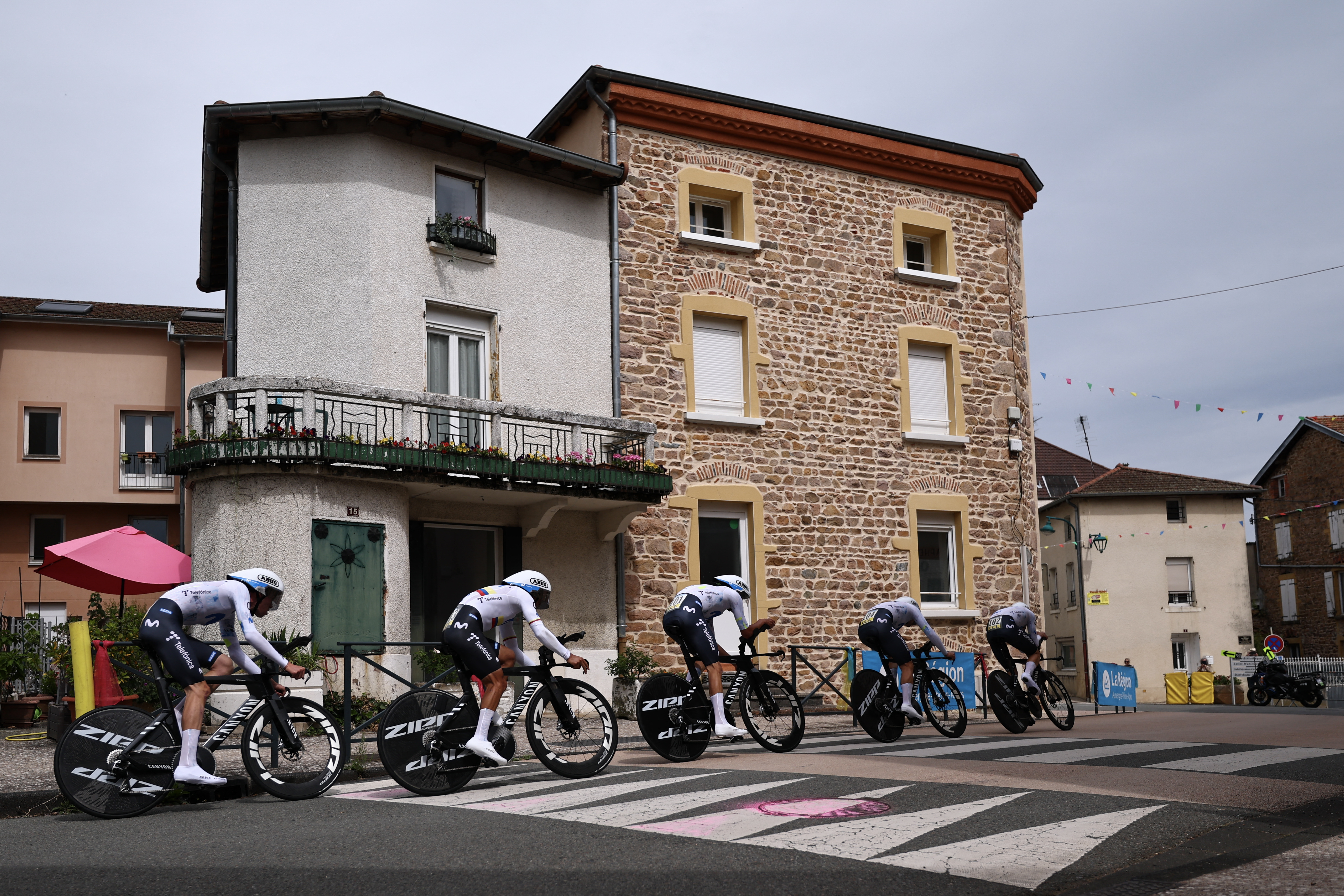 Movistar Team riders cycle during the 3rd stage of the Tour Auvergne-Rhone-Alpes cycling race (formerly known as the Criterium du Dauphine), 28,4km team time trial departing and arriving in Perreux central France, on June 9, 2026. (Photo by Anne-Christine POUJOULAT / AFP via Getty Images)