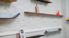 Shelving on a white brick wall