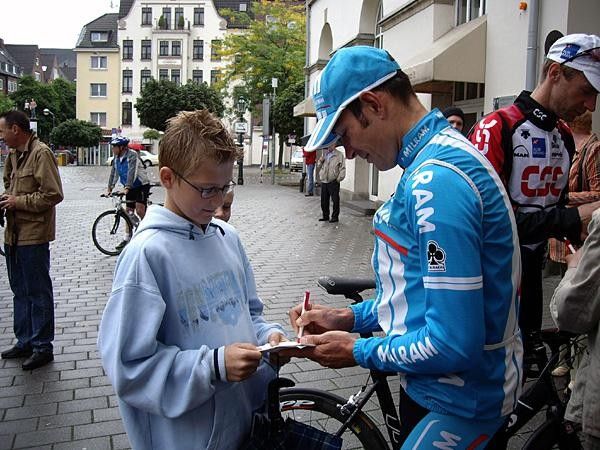 Erik Zabel signs autographs for young fans